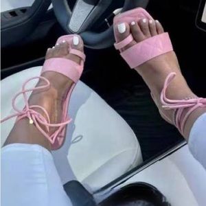 Pink lace up sandals